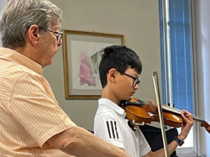 Violin Student in a Lesson